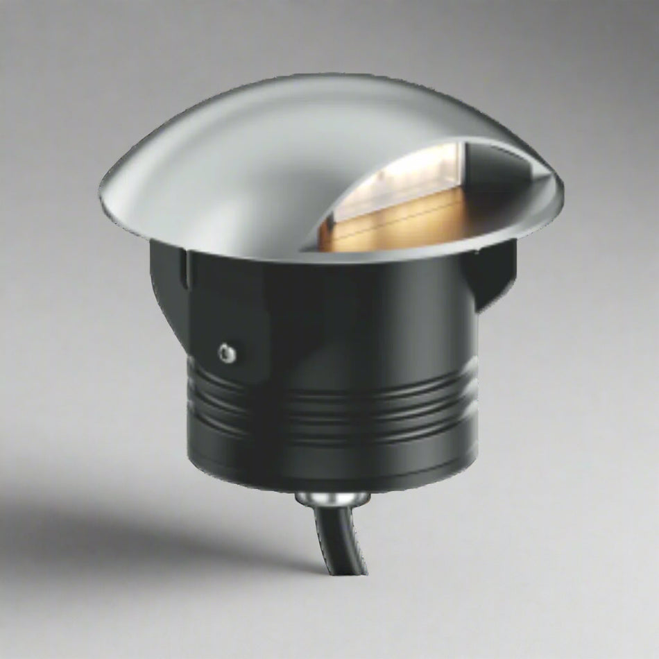 Close-up of the EST-SIG1000107 Outdoor Inground LED Light installed along a modern driveway.