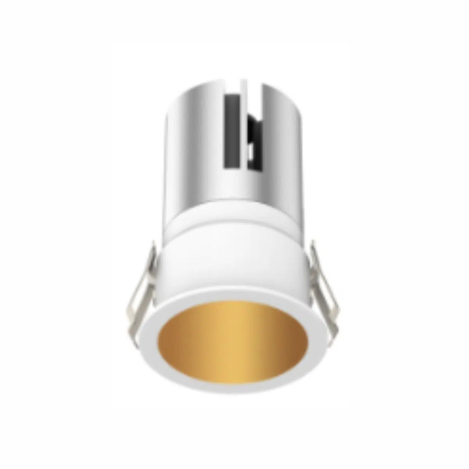 FS1267-10 Indoor Fixed Spot Light - elegantly recessed in a pristine white ceiling. The luminaire casts a crisp, focused light beam onto a surface below, illustrating its application for accentuating interior elements.